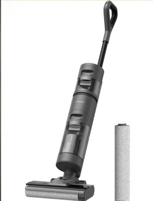 a close up of a vacuum and a battery on a white background