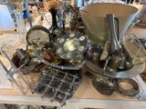 a table with a lot of silver items on it