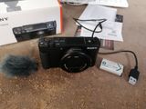 a sony camera with a microphone attached to it