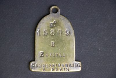 an old brass bell with the name of the city of paris on it