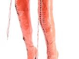 pair of pink sued boots with laces on the toes