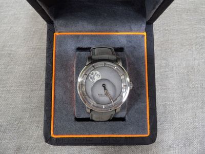 a watch that is in a box on a table