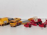 many toy trains that are lined up in a row
