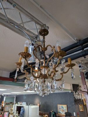 a chandelier hanging from the ceiling in a store