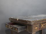 a small table with a drawer on top of it