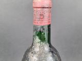 a bottle of wine that is sitting on a table