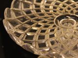 a glass bowl with a decorative design on it