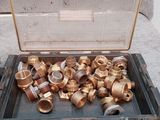 a tool box full of copper pipes and fittings