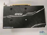 a close up of a black and white graphics card on a white surface