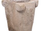 a stone pot with a handle on a white background