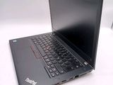 a black laptop computer sitting on a white table