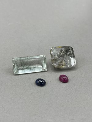 two different colored gems sitting next to each other on a table