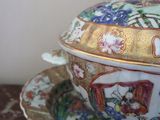 a bowl and saucer sitting on a plate on a table