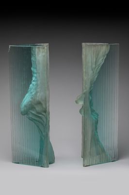 pair of art deco bookends of a woman ' s head and a man ' s head
