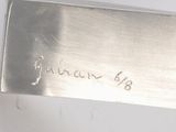 a knife that has writing on it on the blade