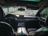 a view of the inside of a car from the driver ' s seat