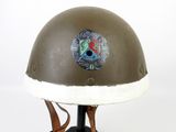 an image of a helmet with a badge on the side of it