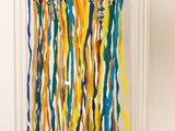a colorful streamer hanging on the wall next to a door