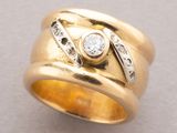 an image of a gold ring with diamonds on it