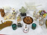 many different types of figurines on a white cloth
