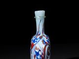 chinese blue and white glass snuff bottle with red, white, and blue swirl design
