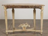 a small table with a wooden top on a wooden floor