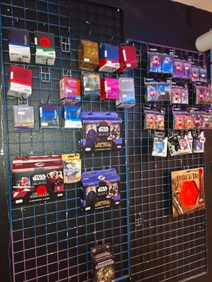 a wall with many different items on it in a store