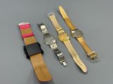 three different types of watches are shown on a gray surface