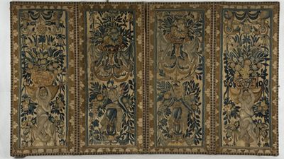 a close up of a tapestry hanging on a wall