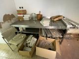 a table with a bunch of boxes on it in a room