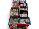 a lot of dvd ' s sitting in a red box