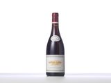 a bottle of red wine sitting on top of a table