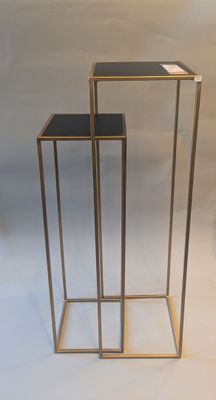two tables that are standing next to each other