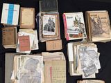 a lot of old books on a black table