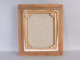 an old picture frame with a picture of a cat on it