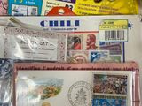 a lot of stamps and postcards on the table