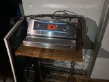 a microwave that is sitting on top of a wooden table