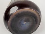 a close up of a glass object on a white surface