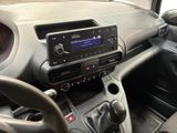 the interior of a car with a steering control and dashboard controls