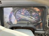 a close up of a car dashboard with a speedometer