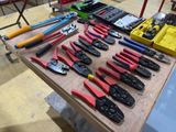 many different types of pliers and tools on a table