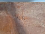 a brown book with writing on it sitting on a table
