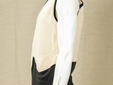 an image of a mannequin wearing a black and white outfit