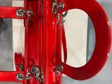 a red purse that is sitting on a table