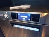 a toothbrush sitting on top of a stainless steel oven