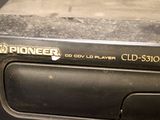 a cd player sitting on top of a cd player
