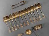 a lot of silver spoons and spoon spoons on the table