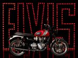 the motorcycle is parked in front of a sign with red lights