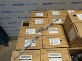 several boxes are stacked on top of each other in front of a wall