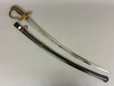 a close up of a sword on a table with a pair of scissors